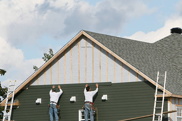 Professional Siding technician working in Wickhaven, PA